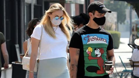 Mom-to-be Sophie Turner layered her icy blue bodycon dress with a ...
