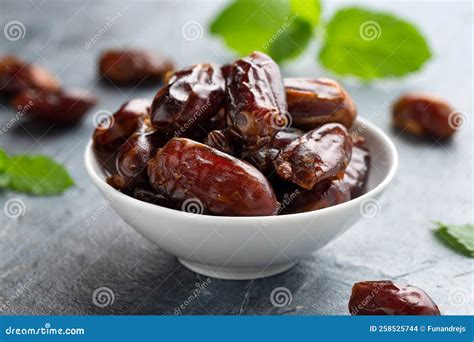 Organic Dried Dates Fruit in White Bowl Stock Photo - Image of middle ...