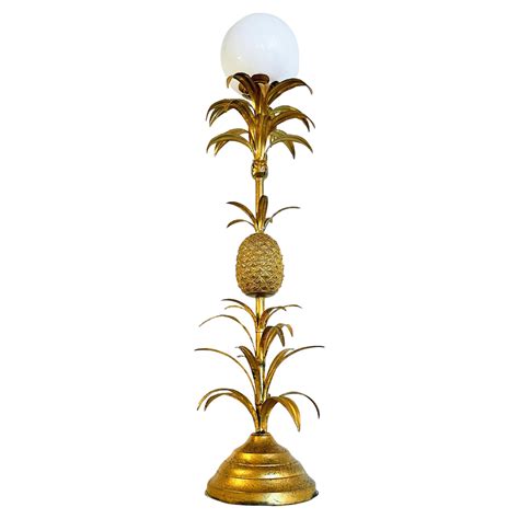 Large, luxurious floor lamp with a pineapple made of gilded metal and ...