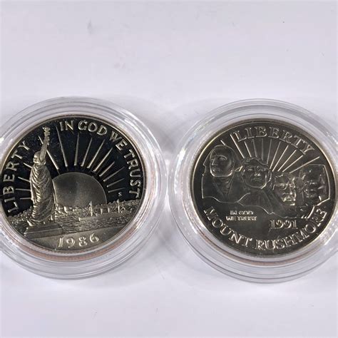 Lot of 2 Commemorative Half Dollars Liberty & Olympics | Property Room