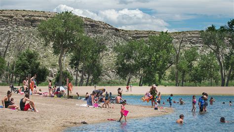 Swimmers return to Rock Canyon Swim Beach at Lake Pueblo State Park