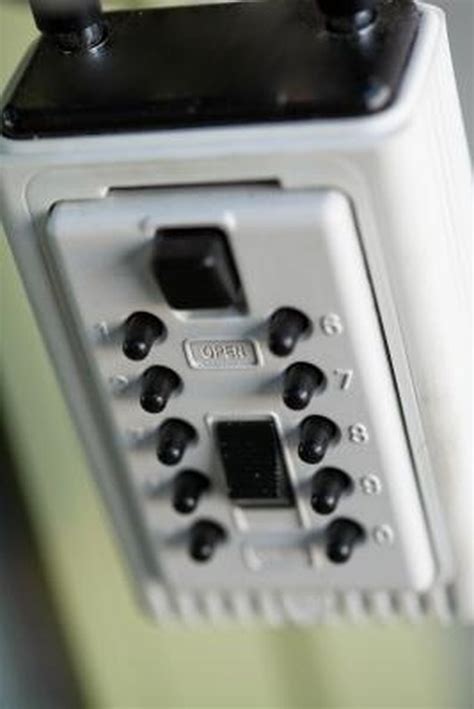 Image result for Master Lock Lockbox Change Code