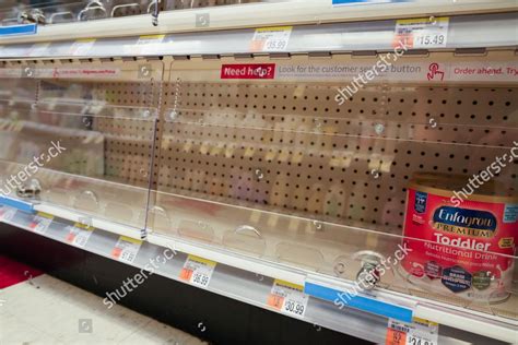 A baby formula display sits nearly empty at a Target store in Orlando.