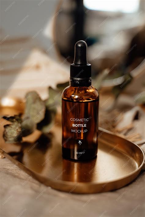 Premium PSD | Amber glass essential oil bottle mockup on metal tray