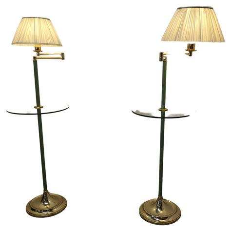 A Pair of French Art Deco Adjustable Swing Arm Floor Lamps, reading ...