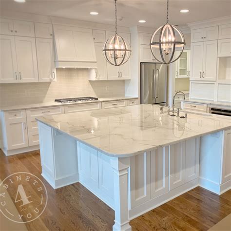White kitchen with large island with seating | Kitchen island with ...