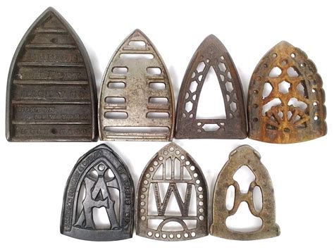 Lot - (7) Cast Iron Sad Iron Trivets