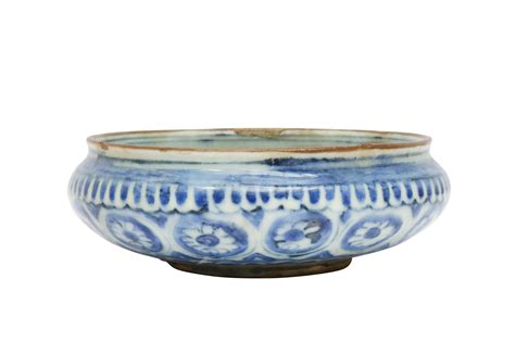 Lot 38 - SIX CHINESE-INSPIRED BLUE AND WHITE POTTERY