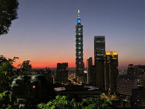 Photo of Taipei 101 tower against a blue sky.