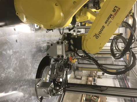 Image result for Automated Assembly Cell with Robot