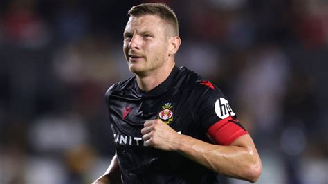 Paul Mullin to miss start of Wrexham's League One season after spinal surgery as Ryan Reynolds ...