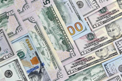 Premium Photo | Many one hundred and fifty dollar bills on flat ...