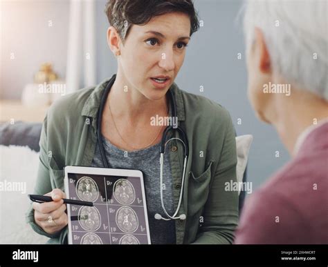Senior woman, doctor and brain scan with tablet, xray and MRI results ...