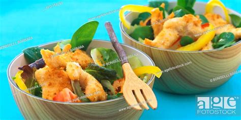 Mixed salad with strips of coconut chicken, Stock Photo, Picture And ...