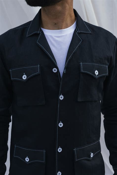 Black safari shirt with white contrast stitch and floral detail ...