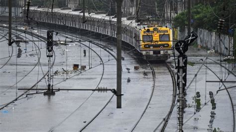 Mumbai local trains face delay amid heavy rain, low visibility and ...