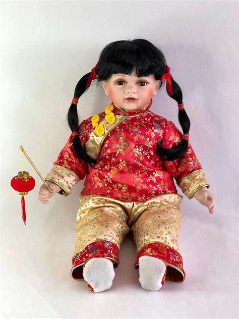 Jmisa 26 Porcelain Baby Chinese Girl Sitting Doll | Desertcart INDIA