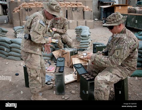 Spc. Jonathan Schueman right, Pfc. Robert Paden left front, and Pfc ...