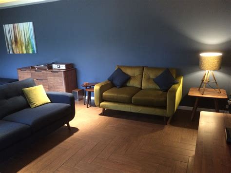 Lounge with wood effect ceramic floor tiles using a herringbone pattern ...