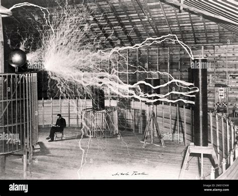 Nikola Tesla, with his equipment for producing high-frequency ...