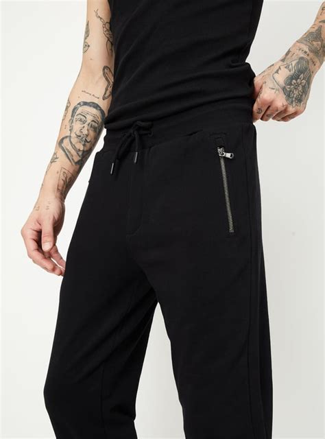Buy Men Solid Joggers with Zip Pockets Online at just Rs. 999.0 ...