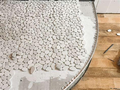DIY Guide To Installing A Bathroom Shower With River Rock Floor | Storables