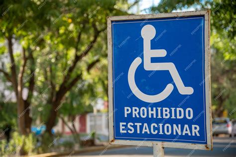 Premium Photo | Blue no parking handicapped parking placard sign in spanish