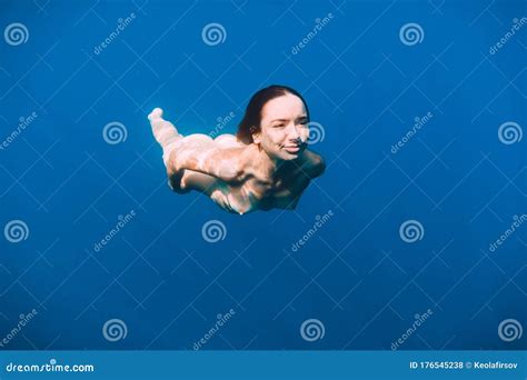 Slim Naked Woman Posing Underwater In Transparent Blue Ocean. Nude Young Women Swimming In Sea ...