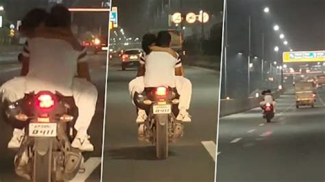Ghaziabad Couple Romance On Speeding Bike While Zooming Past Busy ...
