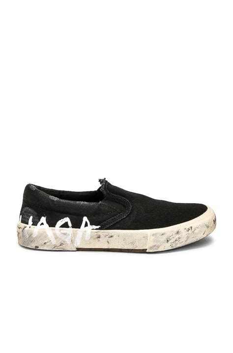 Balenciaga Paris Slip On Sneaker in Black & White | FWRD