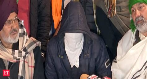 Watch: Farmers at Singhu border present masked man who alleged shootout ...