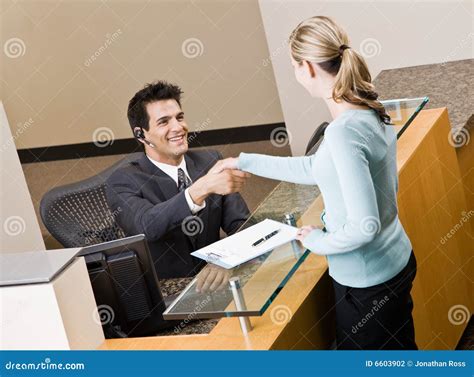 Receptionist Greeting Woman at Front Desk Stock Photo - Image of person, communication: 6603902