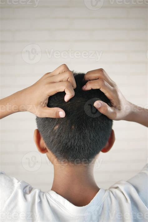 teenage boy Scratching Head Against black background . 13944789 Stock ...