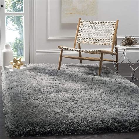 Gray shaggy rug in a room with a wooden chair and decorative items.