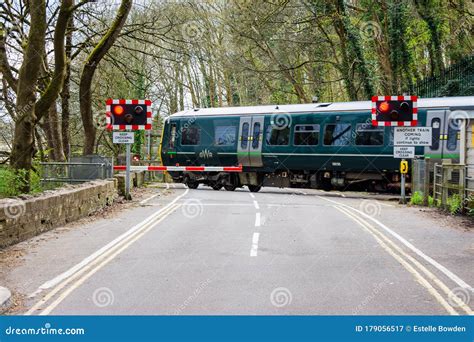 Train Crossing a Level Crossing Editorial Photography - Image of ...