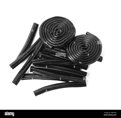 Tasty black liquorice candies on white background, top view Stock Photo ...
