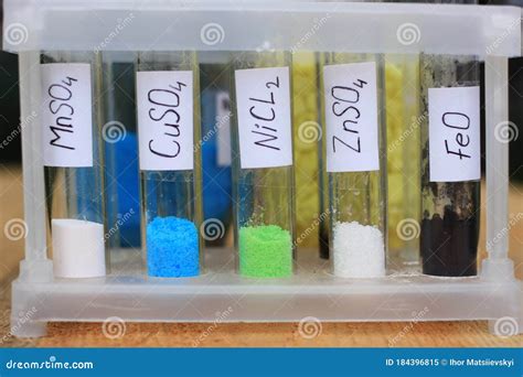 Colored Inorganic Salts In Test Tubes With Formulas, Against The Background Of Organic Formulas ...