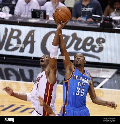 Miami Heat power forward Chris Bosh (1) and Oklahoma City Thunder small ...