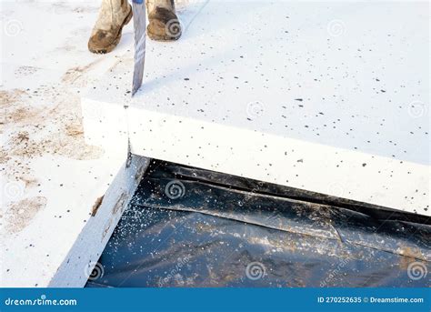 Builder Placing Polystyrene Insulation Boards on Waterproofing Membrane ...