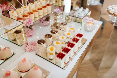 Delicious Wedding Reception Candy Bar Dessert Table Full with Cakes and ...