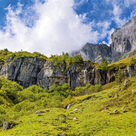 Download wallpaper 1280x1280 cliff, rock, grass, clouds ipad, ipad 2 ...