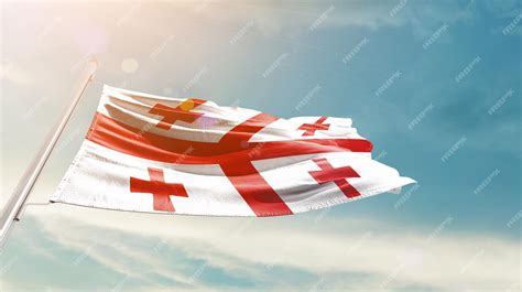Premium Photo | Georgia flag waving in the beautiful sky