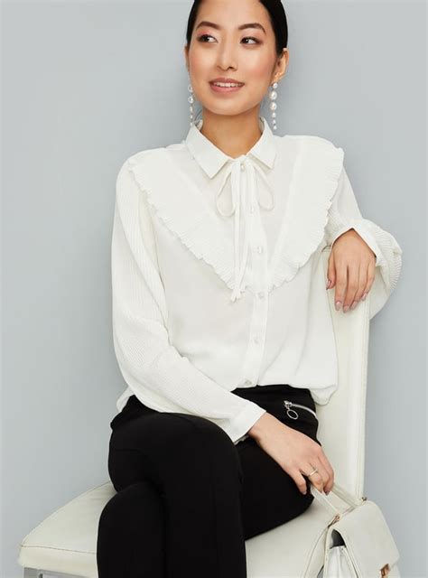 Buy Women Solid Tie-Up Neck Top Online at just Rs. 899.0 ...