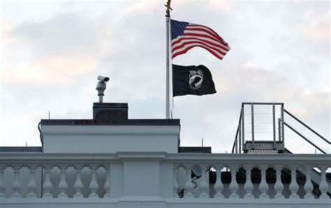 POW-MIA flag back atop White House, reversing Trump era decision | Reuters