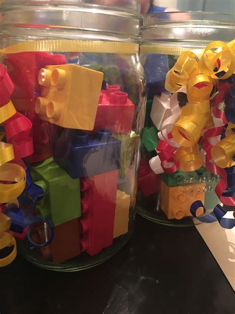 LEGO centerpieces with mason jars. | Lego party, Mason jar centerpieces ...
