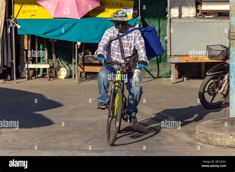 SAMUT PRAKAN, THAILAND, FEB 07 2023, A man with hidden face ride on a ...