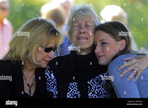 Julie Strickland, sister of Evelyn Babb, center, grieves with Evelyn's ...