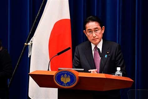 Japan unveils record budget in boost to military spending | Reuters