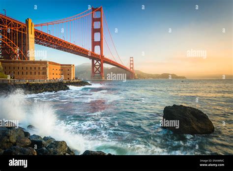 The Golden Gate Bridge, seen at sunrise from Fort Point, San Francisco ...