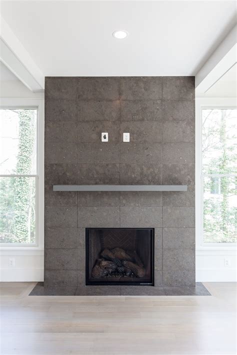 Cement tiled fireplace with gray mantel and herringbone firebox in ...